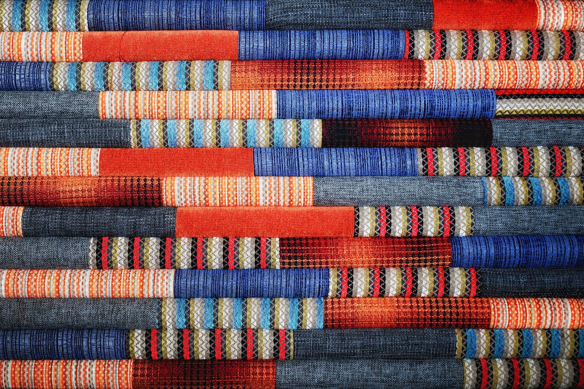 close up of a stack of fabric with different patterns