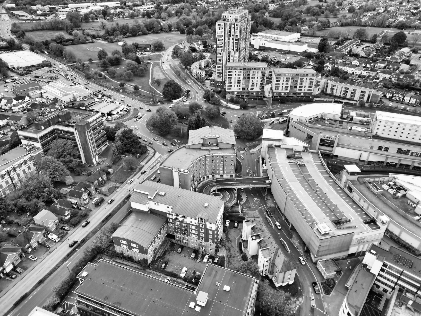 buildings and streets of a city in grayscale
