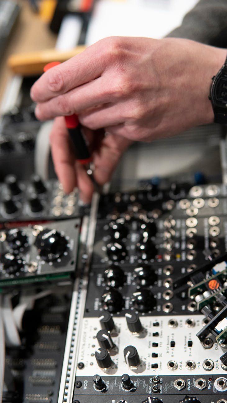 person fixing audio mixer