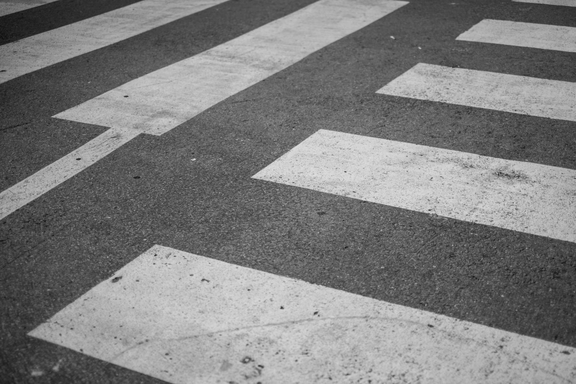 black and white crosswalk pattern on asphalt