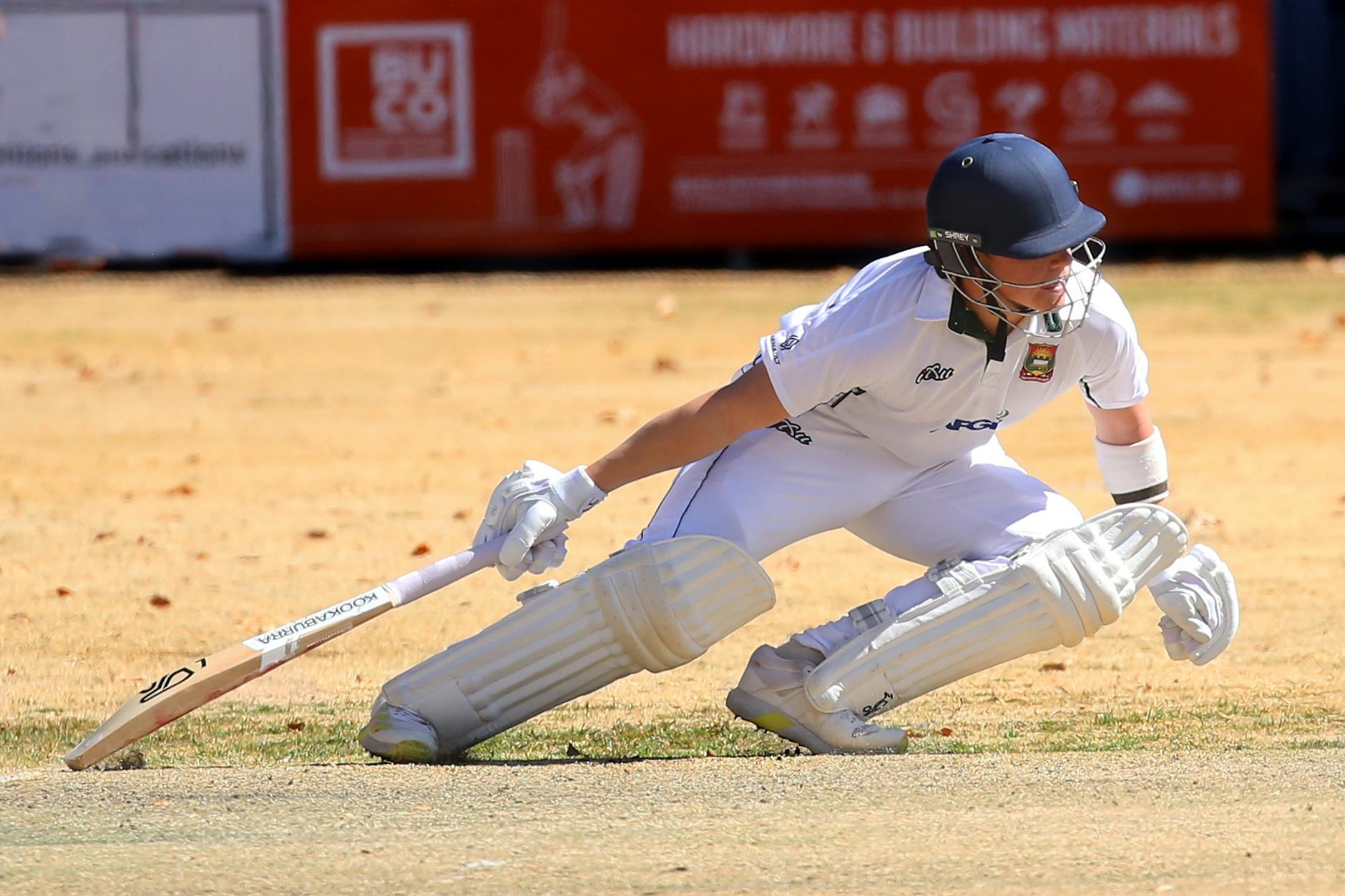 action packed cricket match on sunny day