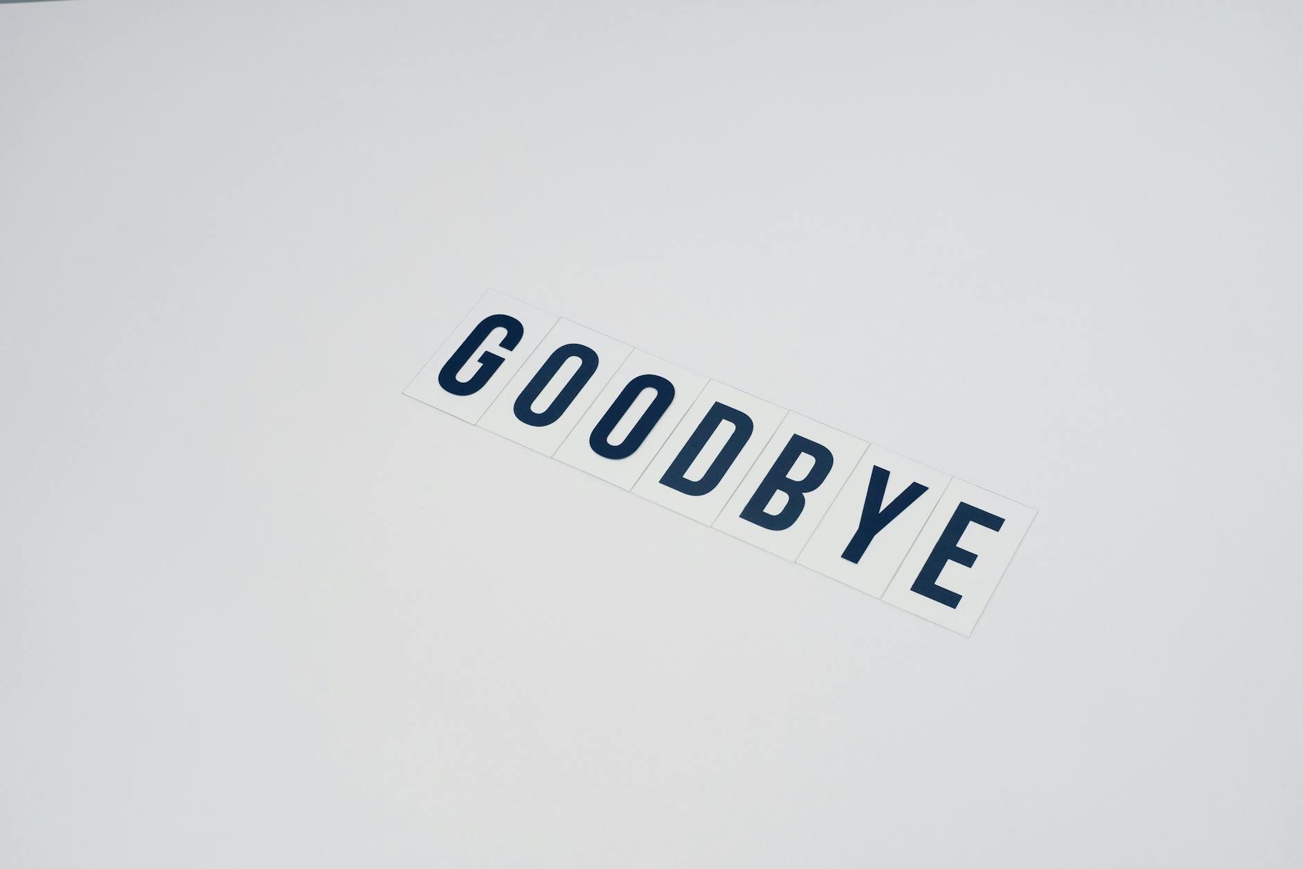 word goodbye on white surface